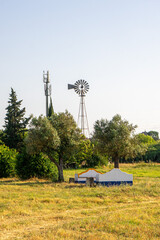 Traditional Alentejo countryside benches painted in vibrant blue and yellow, showcasing the...
