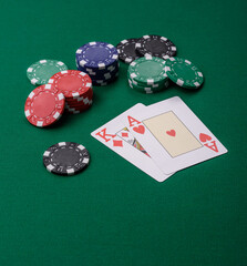 Playing blackjack or baccarat card game in casino with chips, bets and risk. Cards and chips on felt