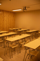 vertical image of classroom empty desks