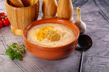 Tasty cheese cream soup with crouton