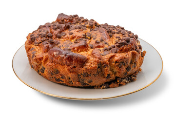 Homemade chocolate chip cake on a white plate with a golden border, isolated