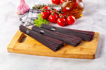 Raw black rice noodles lines