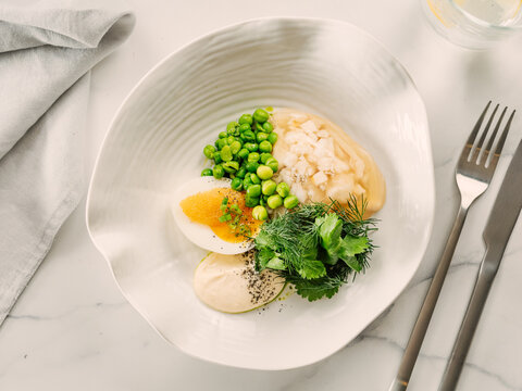 Aspic or Kholodets. Smoked carp aspic served with greens and pike caviar. White chicken meat or fish in aspic with vegetables. Tasty fish or meat in jelly gelatin. Top view. Delicious food background