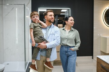 Family choosing bathroom fixtures in plumbing store