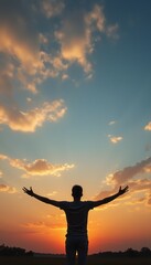 Fototapeta premium Silhouette of a person embracing the sunset