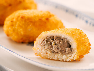 Crispy breaded cutlet. Three perfect crunchy cutlet on plate. Delicious fried cutlets in bread crumbs made from beef, pork, chicken meat or fish