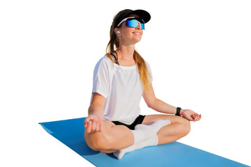 A dedicated individual in athletic wear engages in peaceful and reflective meditation while on...