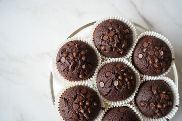 Fresh Homemade Chocolate Muffins close up product shot