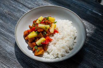 Chicken with pineapple in teriyaki sauce with fried rice. 