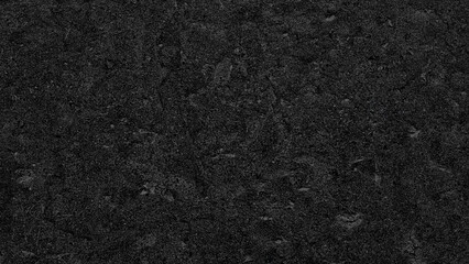 Black rough textured surface background for web banner page template design. creates oppressive and...