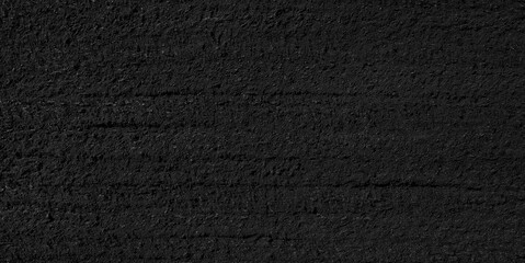 Black rough textured surface background for web banner page template design. creates oppressive and somewhat gloomy mood.