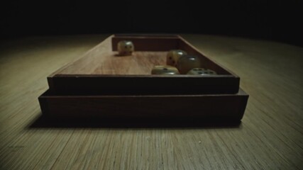 Slow Motion Dice Toss by Hand on Rustic Wooden Surface - Powered by Adobe