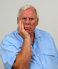 Older man appears to be in deep thought