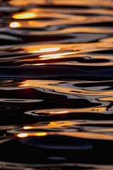 Gilded Ripples Dance Upon Molten Waters