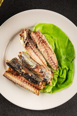 Sardine canned food sprats fish seafood fresh pescetarian diet gourmet food background on the table rustic food top view copy space keto and paleo diet