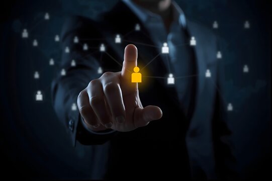 Businessman s finger touching a glowing digital network of people icons representing connection and technology