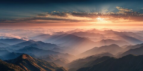 Naklejka premium Majestic Sunrise Over Mountain Range with Golden Rays and Breathtaking Panorama