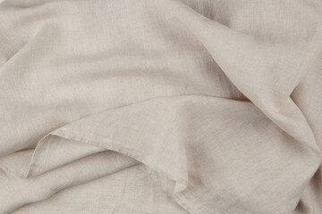 Hemmed edge of natural linen product. Home textile, bedding, or garment. Sustainable materials...