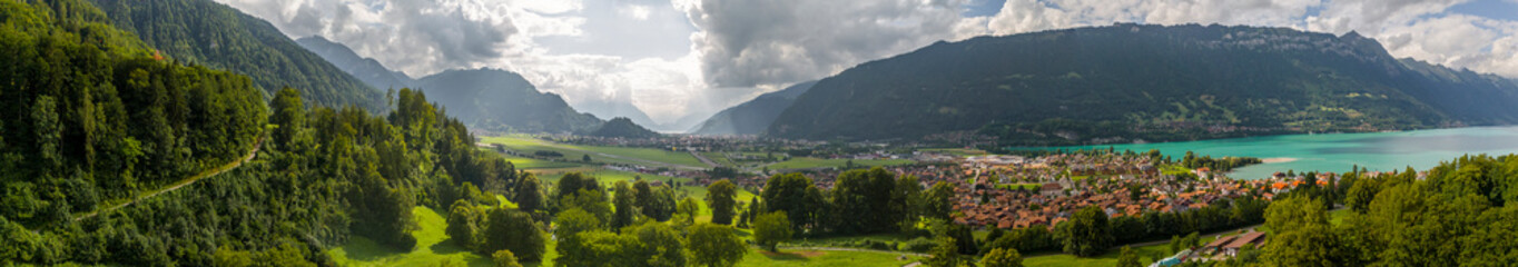 Obraz premium Panoramic Aerial View of Interlaken, Switzerland Between Lake Thun and Lake Brienz with Alpine Mountains
