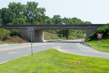 Empty Underpass with 35 MPH Speed Limit Sign – Urban Infrastructure, Roadway Tunnel, Traffic Regulation, No Vehicles, Quiet Street Scene, Transportation Design, City Speed Control Zone