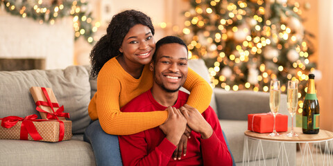 Relationship, date together on New Year night or Christmas eve. Young cheerful african american...