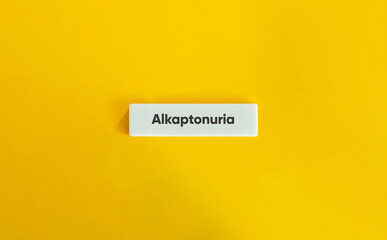 Alkaptonuria Word Tile on Yellow Minimalist Background