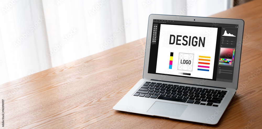 Poster graphic designer software for modern design of web page and commercial ads showing on the computer s