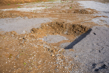 Plate load test results visible on soil surface after static pressure application. Ground...
