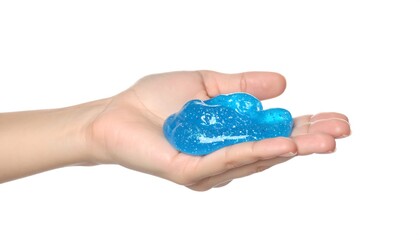 Child's hand holding a vibrant blue slime