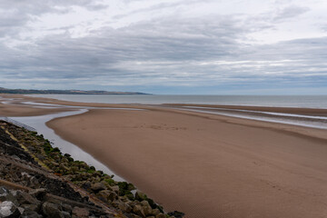 Grey clouds over the expansive beach at Montrose in Angus, Scotland