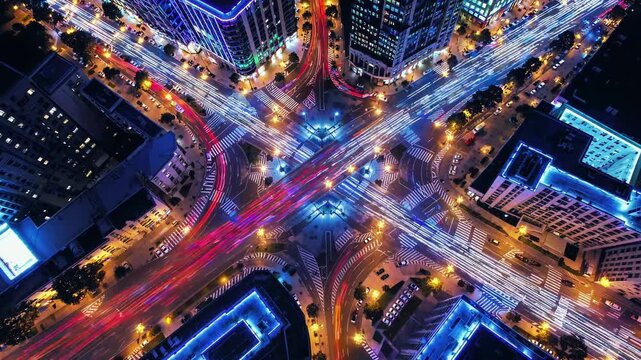 Kaleidoscopic pattern showcasing a vibrant cityscape at night, with light trails illuminating the bustling streets and surrounding buildings, creating a mesmerizing visual tapestry