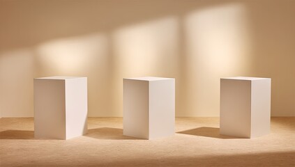 Three blank white cube display pedestals in a  setting.