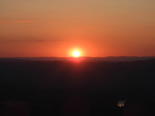 A fiery sunset over the Allegheny Mountains, part of the Appalachian mountain range, viewed from Signal Knob Overlook, Shenandoah National Park, Virginia.