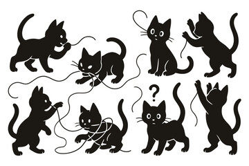 Playful black kittens interacting with string isolated on white background