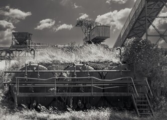 
old underground boiler furnaces in a black and white photograph on a disused industrial site