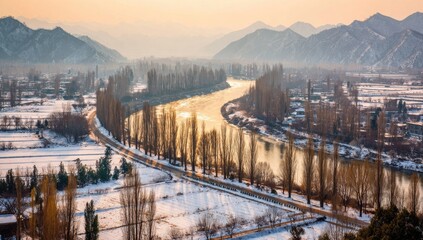 Scenic winter landscape with river winding through snow-covered fields.