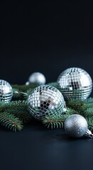 Silver Ornaments and Evergreen Branches Create a Festive Holiday Scene