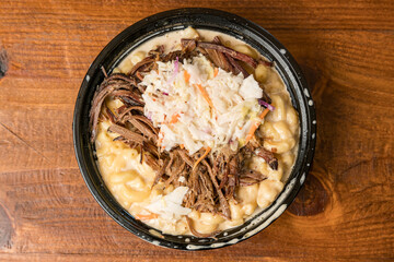 Macaroni and cheese topped with brisket