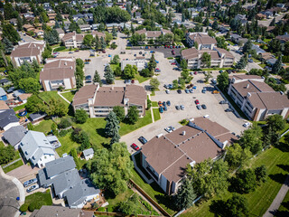 Fototapeta premium View of a residential neighborhood with many houses and a large parking lot
