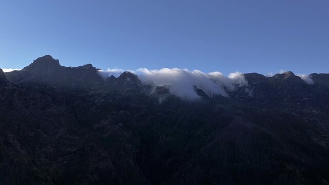 Timelapse of Clouds Rolling Over Mountain Ridges,  hyperlapse clouds rolling over mountain peaks