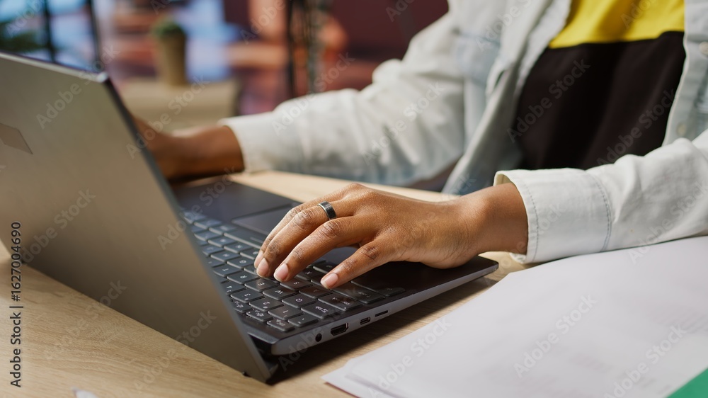 Poster teleworker typing on notebook keyboard in home office to write emails. remote worker using laptop, c