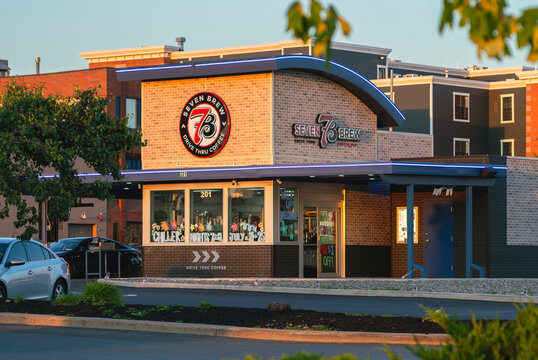 Rome, NY - Jul 23, 2025: Golden-hour view of 7 Brew Coffee is a drive-through only coffee chain known for its double drive-thru lanes, focus on speed and customer service, and a wide variety of drinks