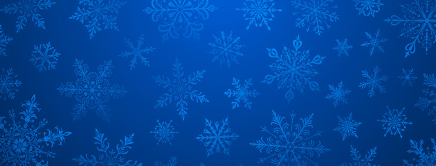 A vibrant Christmas illustration featuring various intricate snowflakes of varying sizes and designs, in blue tones.