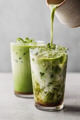 Iced matcha latte being poured (1)