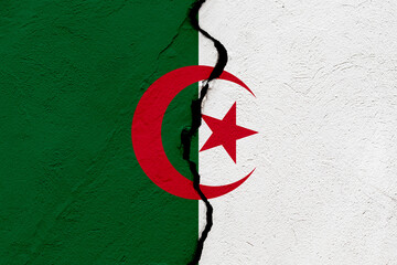 The flag of the Peoples Democratic Republic of Algeria into a grunge cracked wall