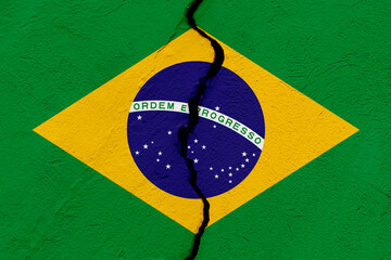 The flag of the Federative Republic of Brazil into a grunge cracked wall