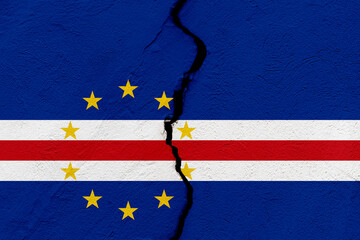 The flag of the Republic of Cabo Verde into a grunge cracked wall