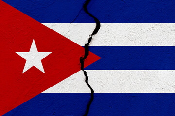 The flag of the Republic of Cuba into a grunge cracked wall