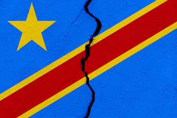 The flag of the Democratic Republic of the Congo into a grunge cracked wall