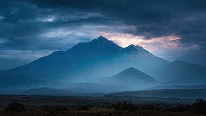 Fototapeta premium Mountain peak bathed in dawn light